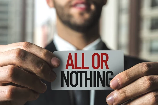 Businessman holding paper with sign — Stock Photo, Image