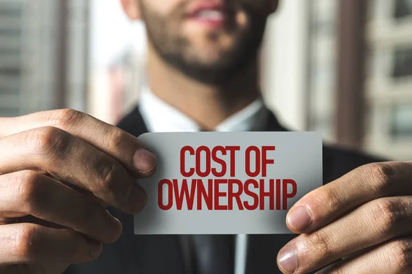 Businessman holding paper with sign — Stock Photo, Image