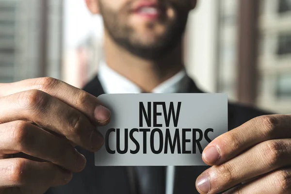 Paper with sign new customers — Stock Photo, Image