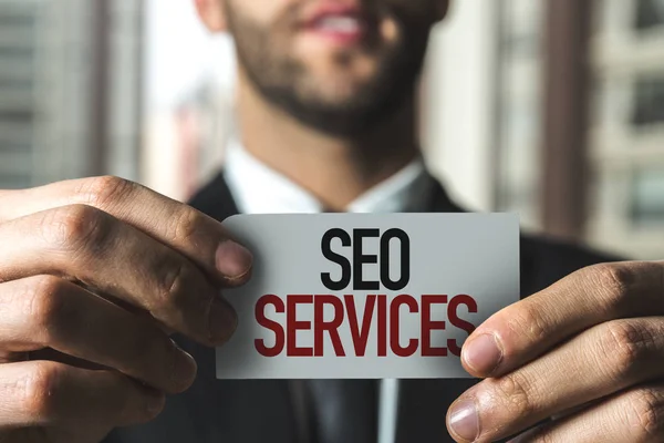 Papier mit Zeichen seo services — Stockfoto