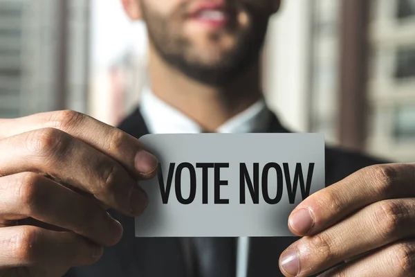 Papel con voto de signo ahora — Foto de Stock