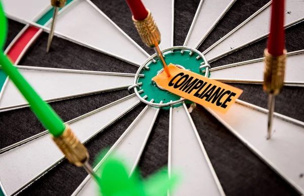 Darts target with inscription compliance — Stock Photo, Image