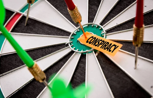 Darts target with inscription conspiracy — Stock Photo, Image