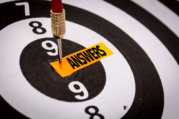 Darts target with inscription answers — Stock Photo, Image