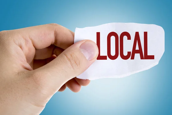 Hand holding paper with sign — Stock Photo, Image