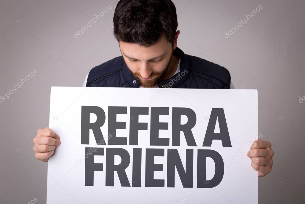 paper with sign Refer Friend