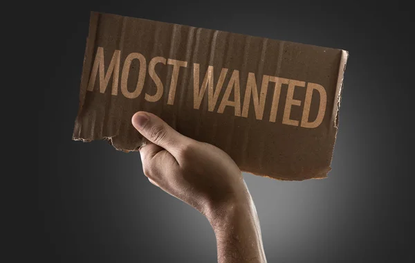 Hand holding cardboard with sign — Stock Photo, Image