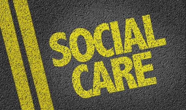 Yellow sign social care — Stock Photo, Image