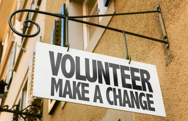 Sign with inscription Volunteer Make Change — Stock Photo, Image