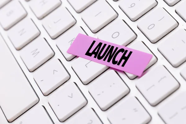 Pink sticker with sign launch — Stock Photo, Image