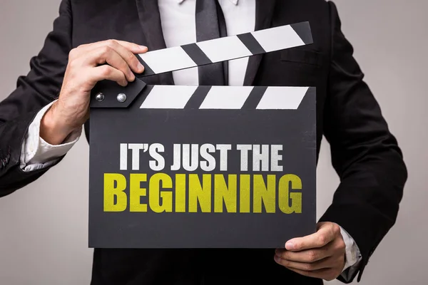 Man holding clapperboard with text — Stock Photo, Image