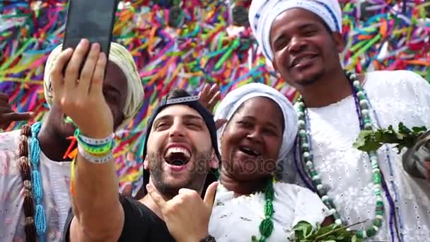 Tourist recording with Candomble group at Bonfim Church in Salvador, Bahia, Brazil — Stock Video