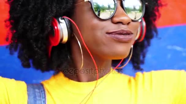 Pretty Girl Listening Music Her Headphones Colorful Background — Stock Video