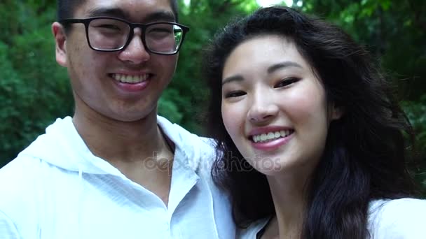 Romantic Young Asian Couple Kissing — Stock Video