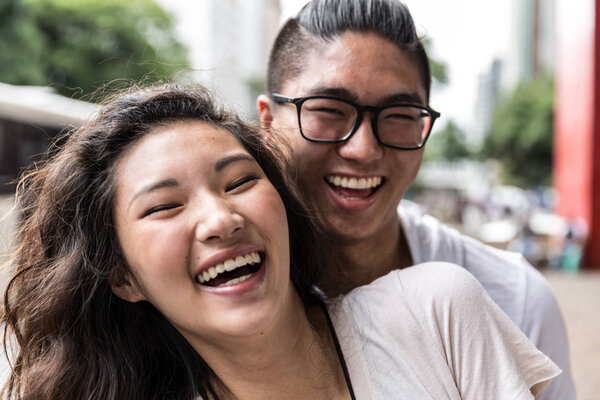 Young Asian Couple Embracing