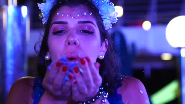 Girl Blowing Colorful Confetti — Stock Video