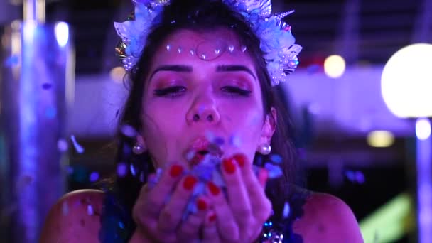 Girl Blowing Colorful Confetti — Stock Video