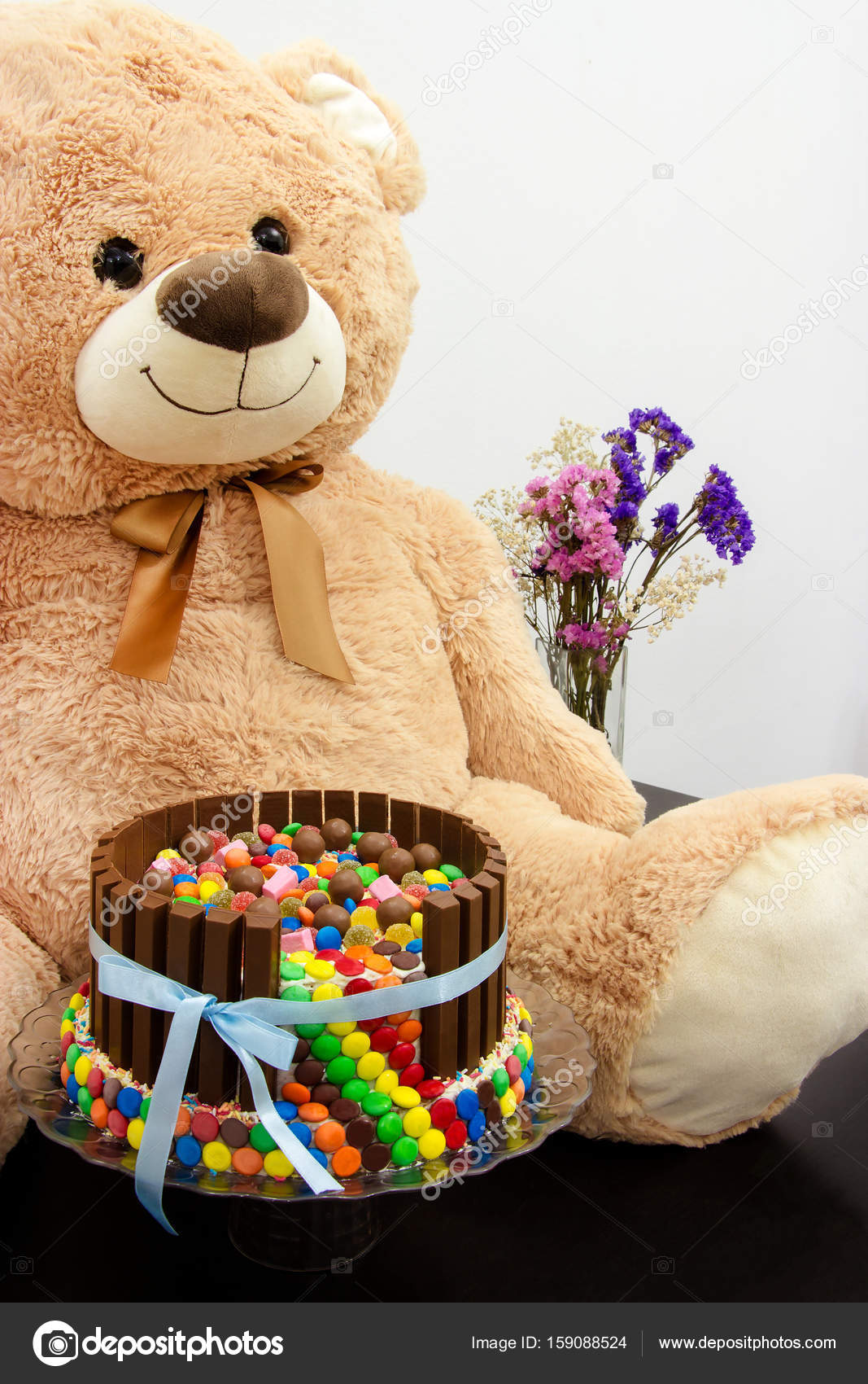 big teddy bear with flowers
