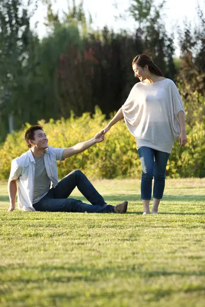 Chinese Woman Holding Hands Sitting Man Park — Stock Photo, Image