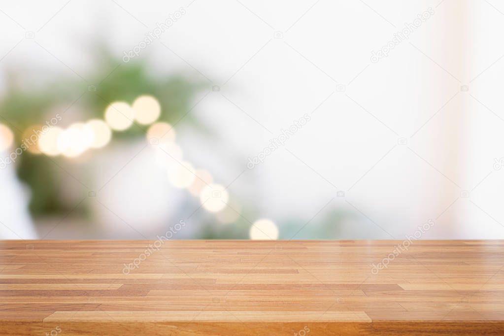 Empty wooden table and green plants and circle light bokeh background
