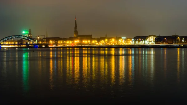 Summer night city light reflections over water — Stock Photo, Image