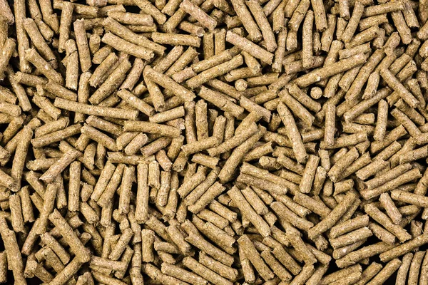 Granulated animal food background texture — Stock Photo, Image