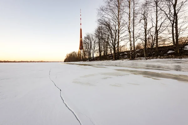Frozen beach in cold winters day with TV tower in background — Stock Photo, Image