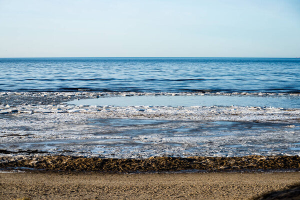 people enjoying frozen beach