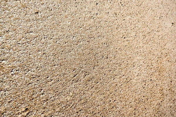 Spiaggia rocciosa con sabbia e ciottoli — Foto Stock