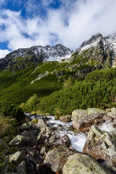 Large Waterfall from ravine in autumn, long exposure with mounta — Stock Photo, Image