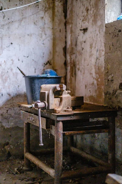 old abandoned house interior with broken furniture and empty windows. woodwork details in dust