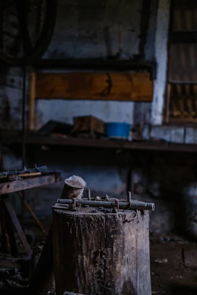 old abandoned house interior with broken furniture and empty windows. woodwork details in dust