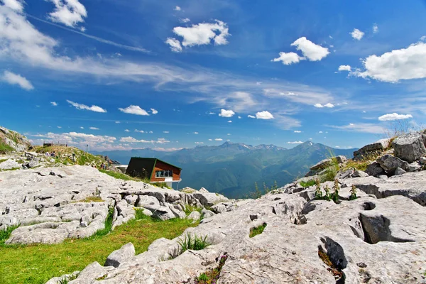 The house in mountains on the brink of  precipice