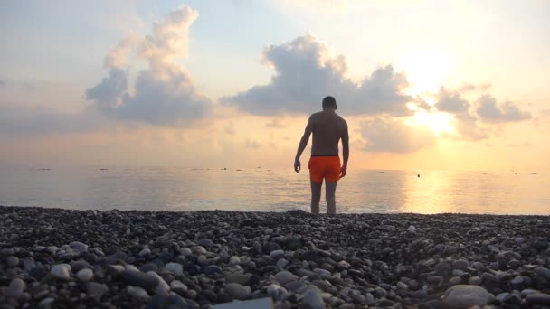 Man walks into the sea in slow motion — Stock Video