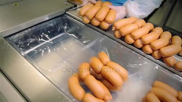 Packing line of finished products. Packing of sausages. — Stock Video