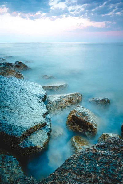 Ocean landscape towards evening. Long exposure photograph at dusk time - Water to fog effect. — Stock Photo, Image