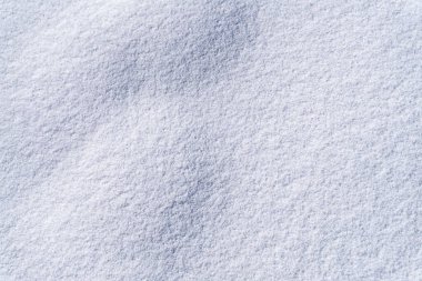 Photography of beautiful pure white snow texture. White snowflakes background rough pattern of snow texture.