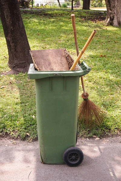 Green plastic bin in nature garden — Stock Photo, Image