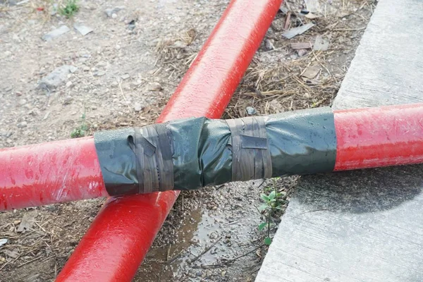 red pipe on the ground