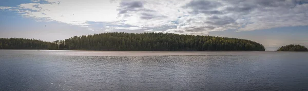 Islands covered with forest with rain clouds — Stock Photo, Image