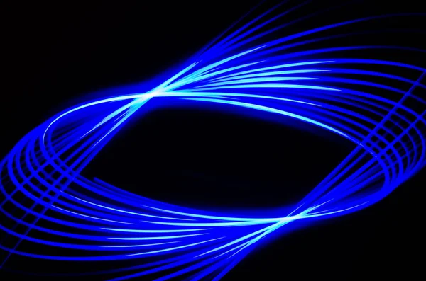 Light spiral and blue lines on a black background — Stock Photo, Image