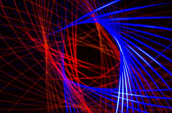 Light spiral, red and blue lines on a black background