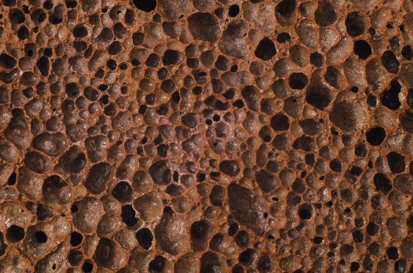 Pumice is a porous brown texture