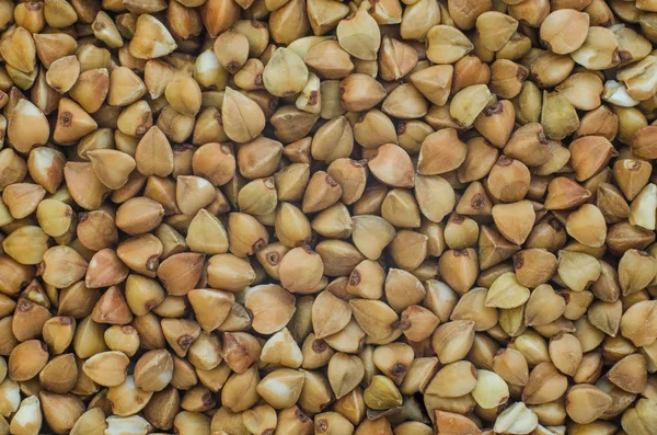 Grain buckwheat close-up background texture — Stock Photo, Image