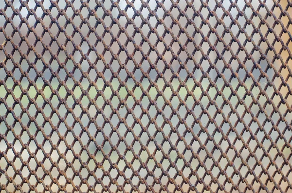 Vecchio tessuto a rete metallica arrugginita — Foto Stock