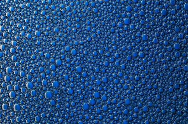 Bulles de mousse sur fond bleu texture — Photo