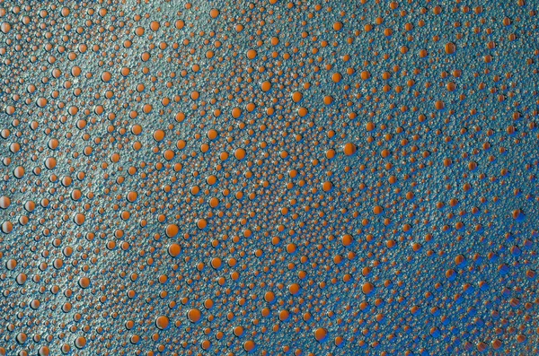 Bulles de mousse rouge sur fond bleu texture — Photo