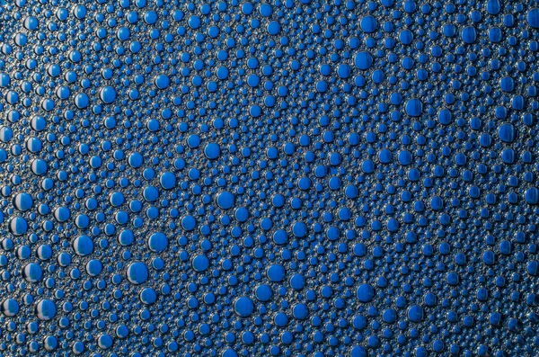 Bulles de mousse sur fond bleu texture — Photo