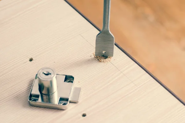 Drilling holes in a wooden block — Stock Photo, Image