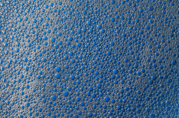 Burbujas de espuma sobre una textura de fondo azul —  Fotos de Stock